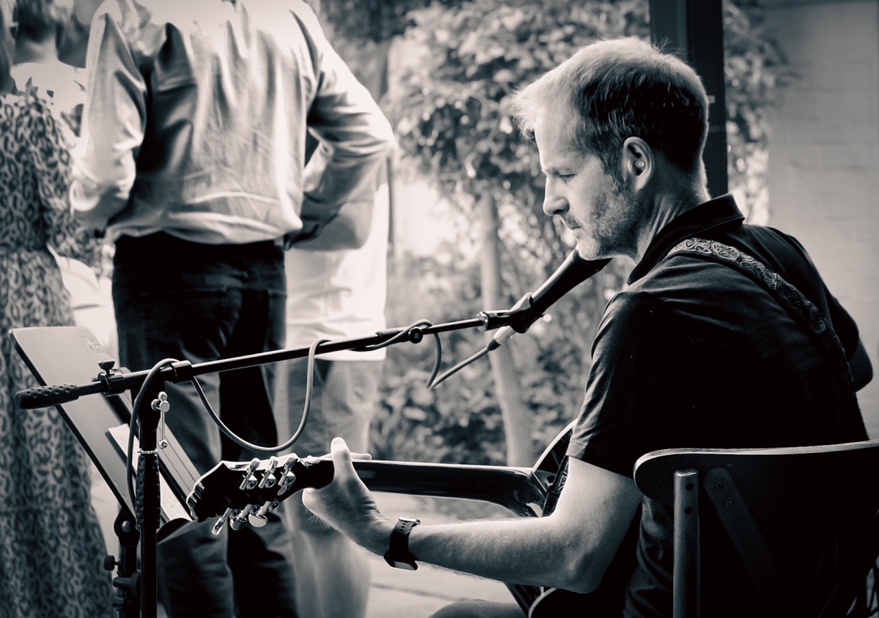 Sean Jeffery playing music at a garden party in around 2023